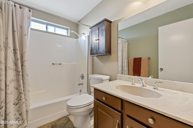 full bathroom with vanity, shower / tub combo, and toilet