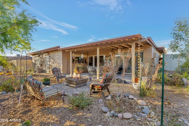 view of patio / terrace featuring an outdoor fire pit