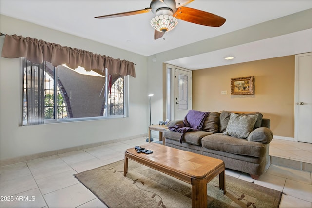 living room with light tile patterned floors and ceiling fan