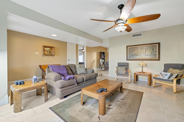 living room featuring ceiling fan and light tile patterned flooring