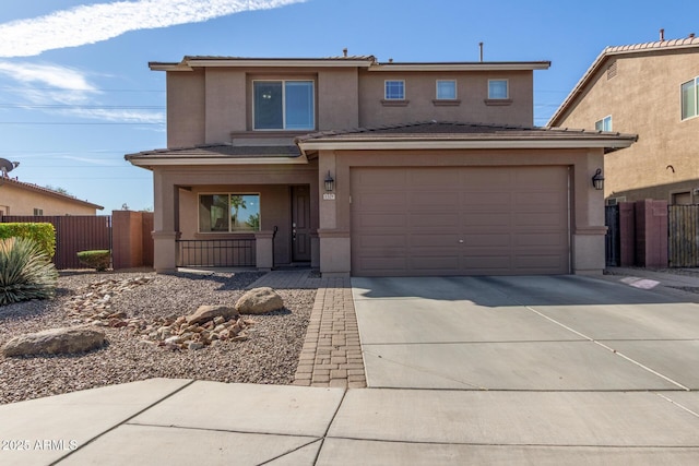 view of front of property featuring driveway, fence, a porch, and stucco siding