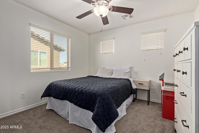 bedroom with ceiling fan, carpet floors, visible vents, and baseboards