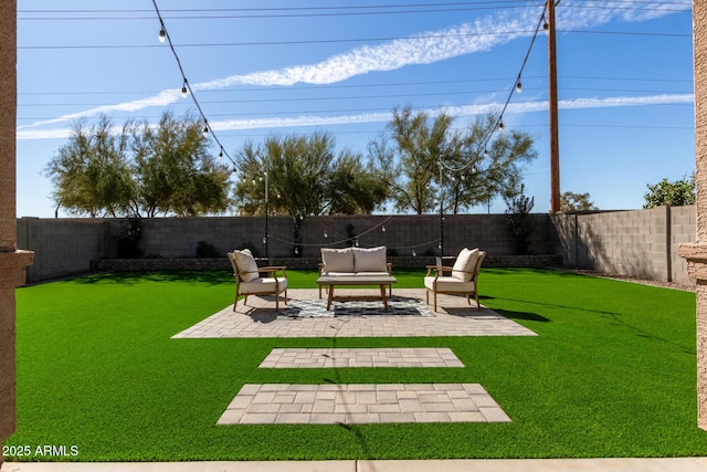 view of yard with a patio area, a fenced backyard, and an outdoor hangout area