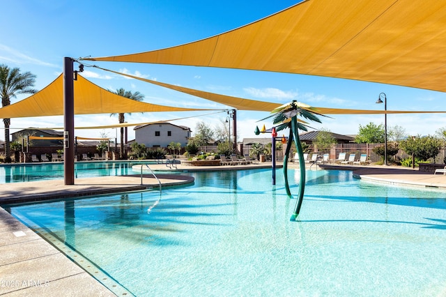 community pool with a patio area