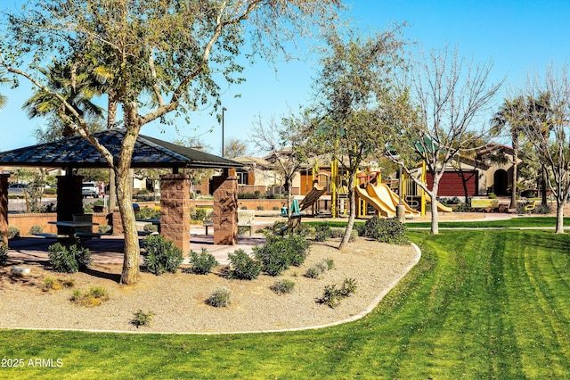 view of yard featuring playground community and a gazebo