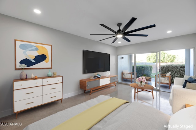 living area with recessed lighting, baseboards, and ceiling fan