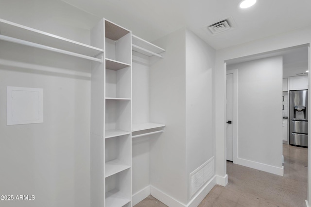 spacious closet featuring visible vents