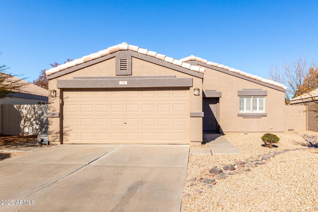 ranch-style house featuring a garage