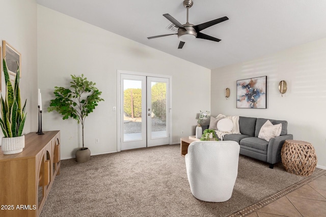 tiled living room featuring ceiling fan, lofted ceiling, and french doors