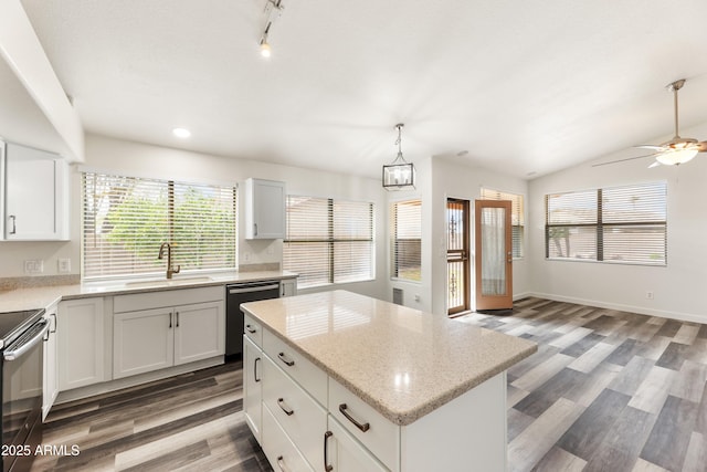 kitchen featuring a sink, range with electric cooktop, dishwasher, and a healthy amount of sunlight