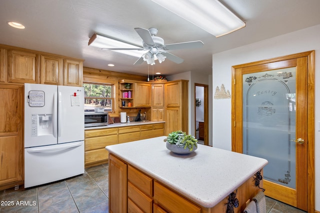 2 Acr 1027 Rd, Greer, AZ 85927 - kitchen with white fridge with ice dispenser, stainless steel microwave, open shelves, ceiling fan, and light countertops