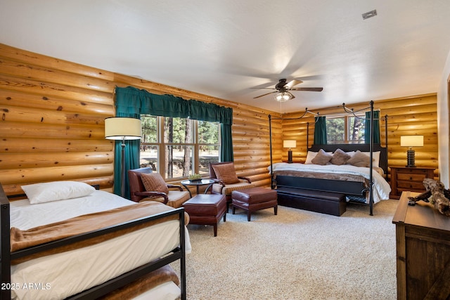 2 Acr 1027 Rd, Greer, AZ 85927 - bedroom featuring log walls, multiple windows, carpet floors, and ceiling fan