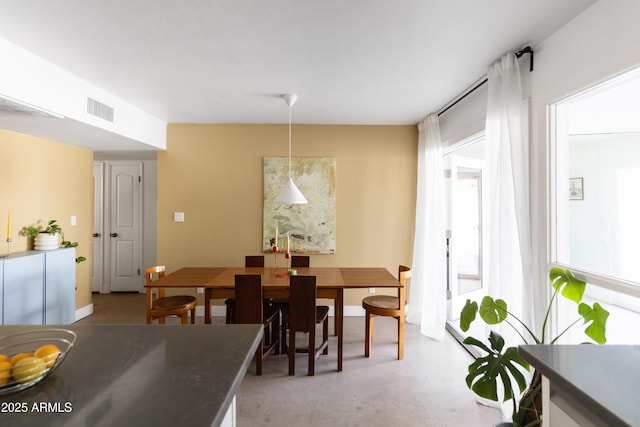 dining room featuring concrete floors