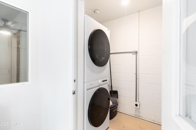 washroom with stacked washer / drying machine