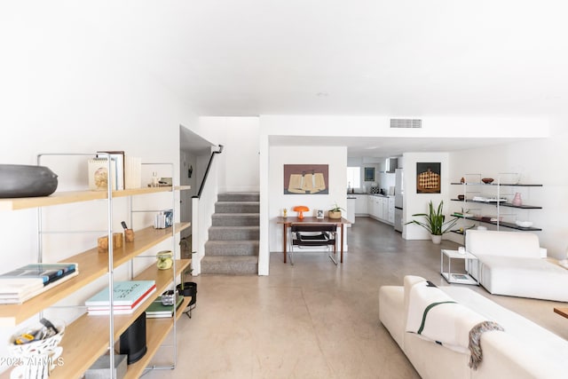 living room featuring concrete floors