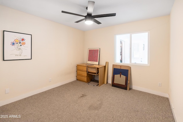 office with light colored carpet and ceiling fan