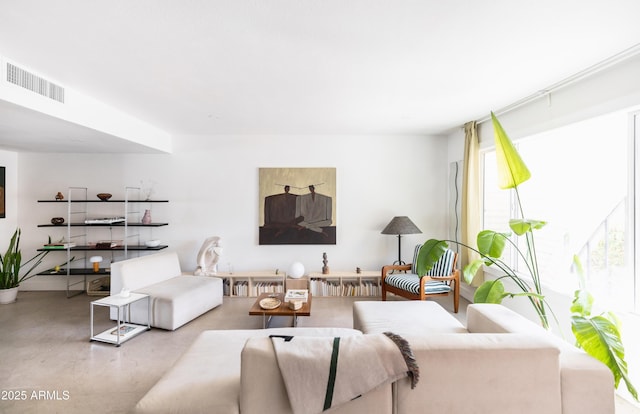 living room featuring radiator heating unit and concrete floors