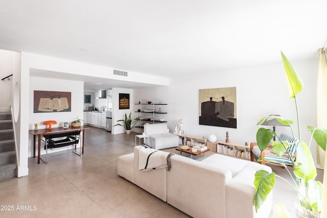 living room featuring concrete flooring