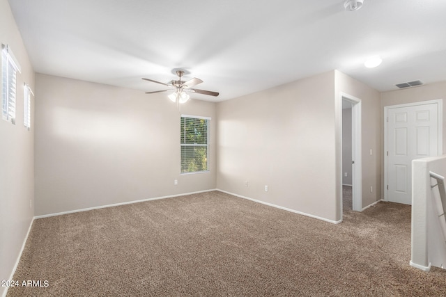 carpeted empty room with ceiling fan