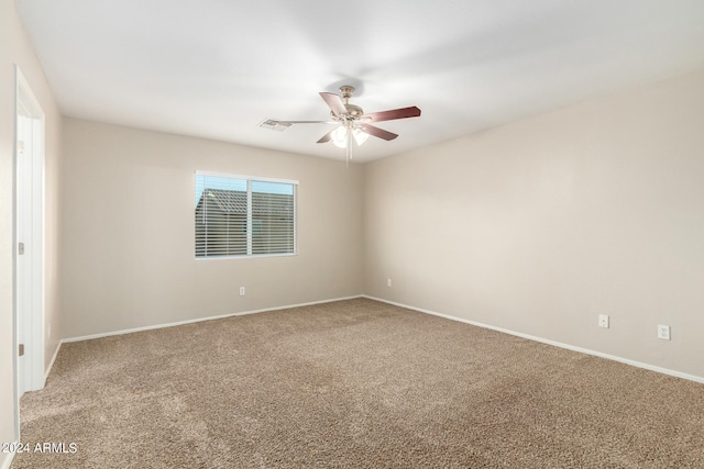 unfurnished room featuring ceiling fan and carpet floors