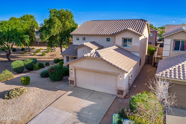 mediterranean / spanish-style home featuring a garage