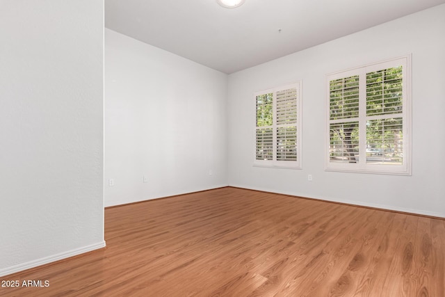 unfurnished room with plenty of natural light and light wood-type flooring