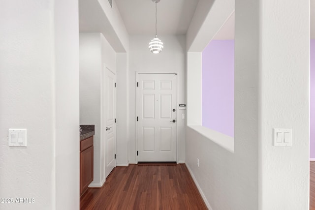 hallway featuring dark hardwood / wood-style floors