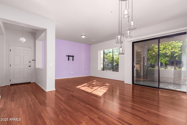 unfurnished living room featuring hardwood / wood-style floors