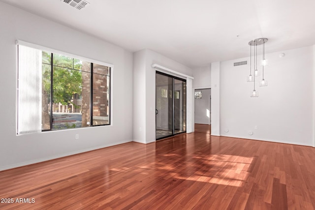 unfurnished room with dark wood-type flooring