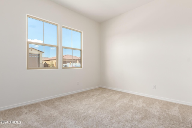 empty room featuring light carpet