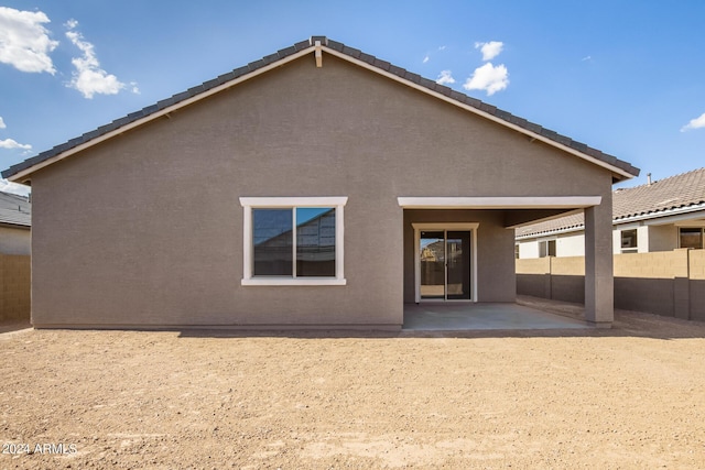 rear view of house with a patio