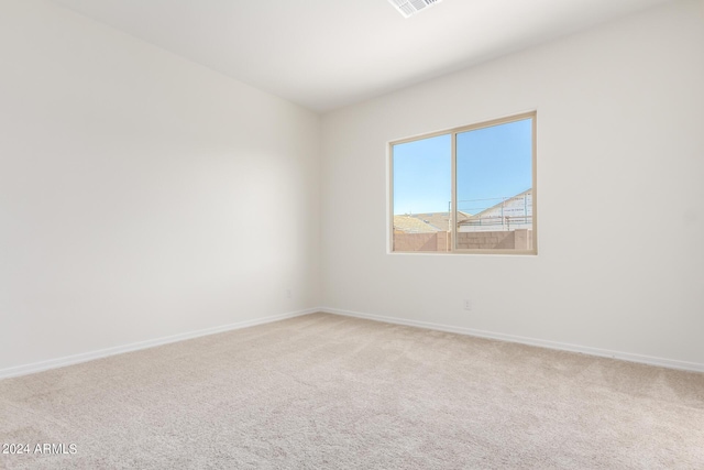 spare room featuring carpet floors