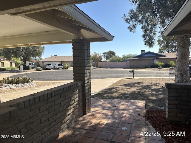 view of patio / terrace featuring fence