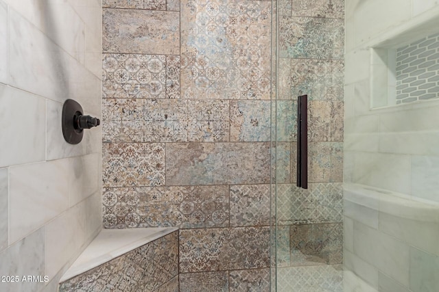 bathroom with a shower stall