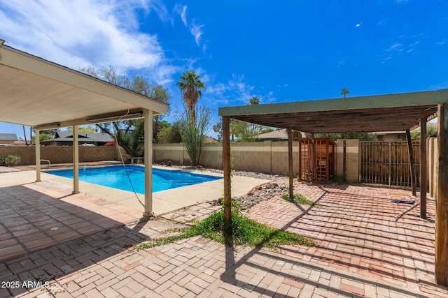 view of swimming pool with a patio, a fenced in pool, and a fenced backyard