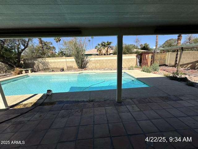 view of pool featuring a fenced backyard, a patio, and a fenced in pool