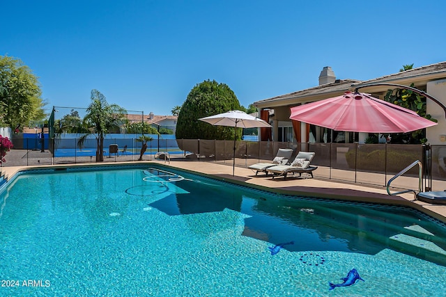 view of pool featuring a patio, fence, and a fenced in pool