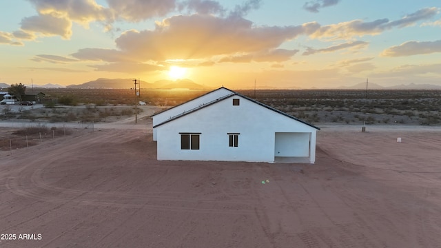 outdoor structure at dusk with a mountain view