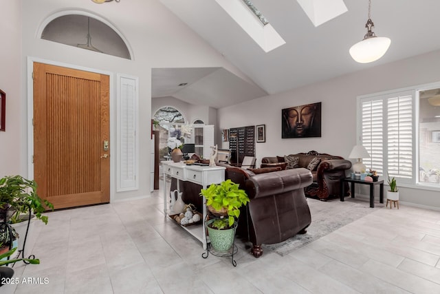 tiled living room with high vaulted ceiling and a skylight