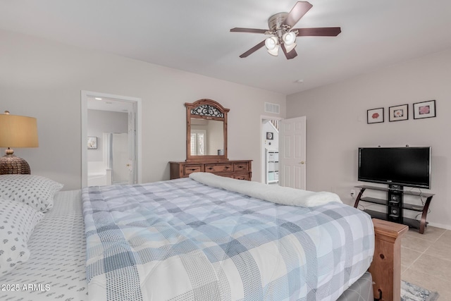 bedroom with ceiling fan, visible vents, connected bathroom, and light tile patterned flooring