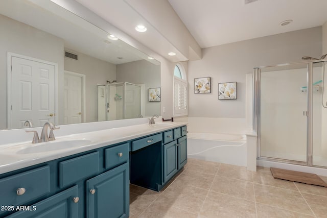 bathroom featuring visible vents, a garden tub, a stall shower, tile patterned floors, and a sink