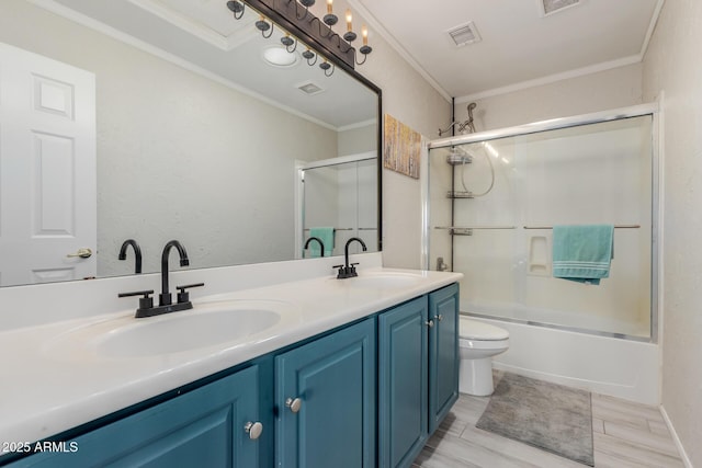 bathroom featuring ornamental molding, visible vents, and a sink