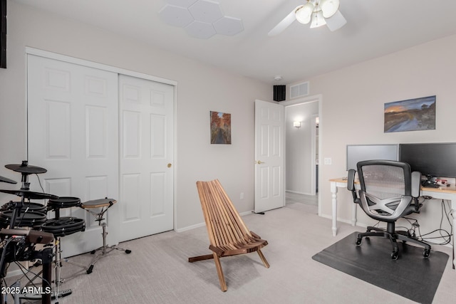 office area featuring visible vents, baseboards, and light colored carpet