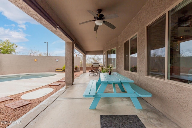 view of patio / terrace featuring outdoor dining area and ceiling fan