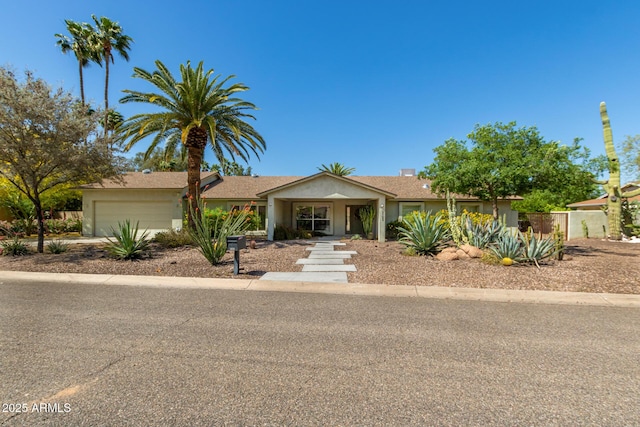 6102 E Aster Dr, Scottsdale, AZ 85254 - single story home with an attached garage and stucco siding