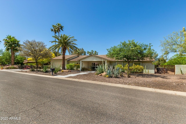 6102 E Aster Dr, Scottsdale, AZ 85254 - view of front facade featuring concrete driveway and an attached garage