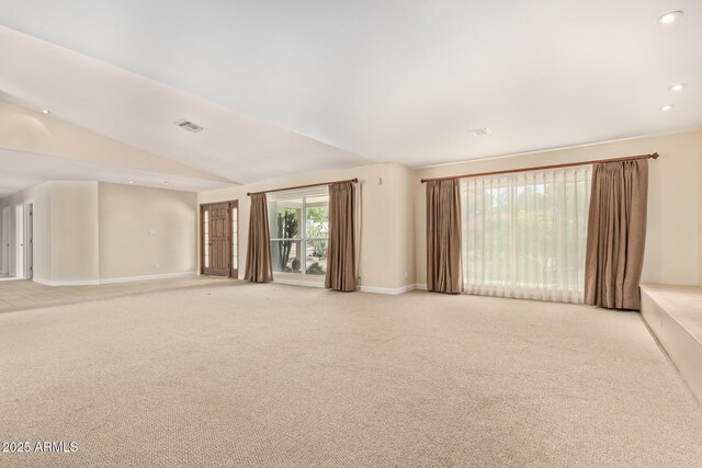 6102 E Aster Dr, Scottsdale, AZ 85254 - unfurnished living room featuring light colored carpet, vaulted ceiling, and recessed lighting