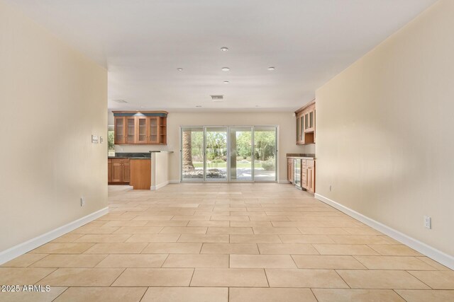 6102 E Aster Dr, Scottsdale, AZ 85254 - unfurnished living room with baseboards and recessed lighting