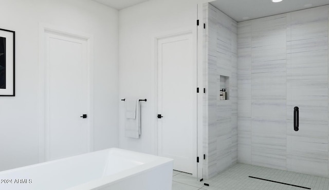 bathroom with tile patterned floors and independent shower and bath