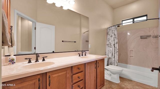 full bathroom with tile patterned flooring, double vanity, toilet, and a sink